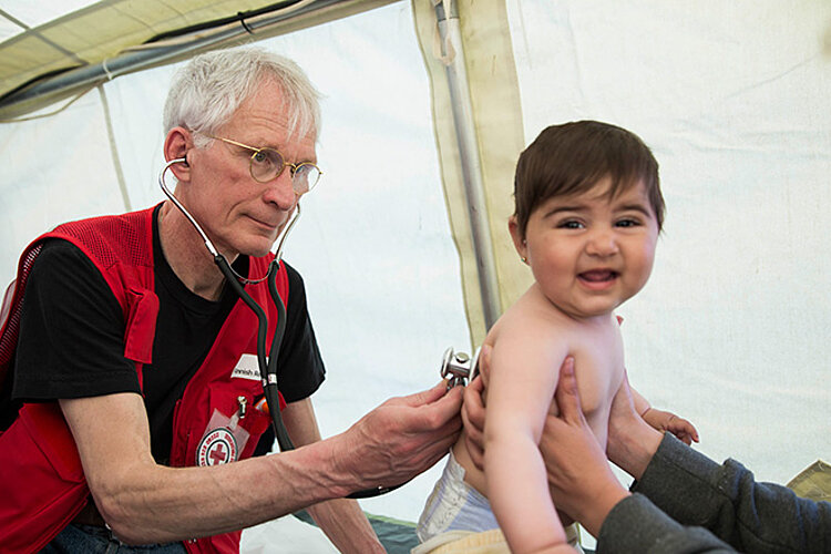 Paediatrician examining an child