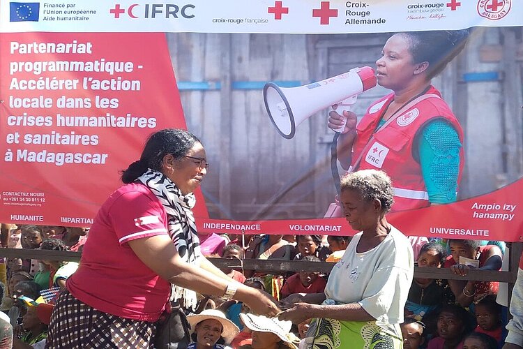 Elderly woman receiving cash assistance