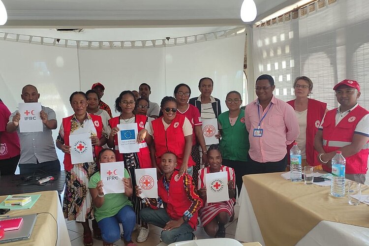 Workshop participants holding certificates