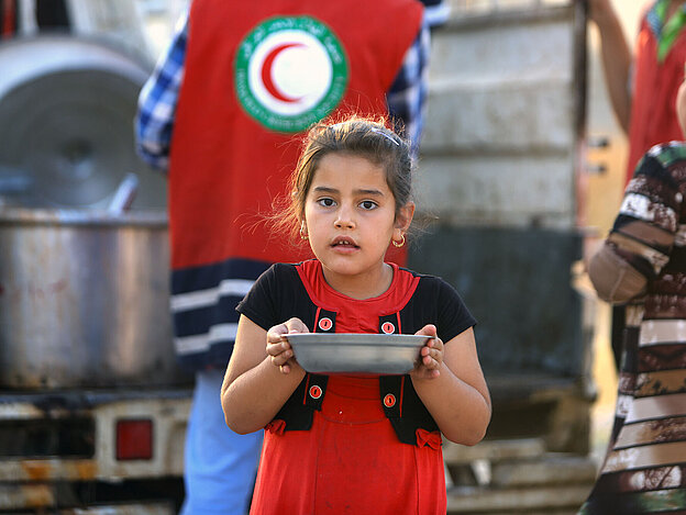 Girl holding metal plate