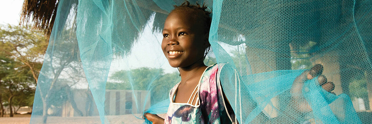 A Child under a mosquito net