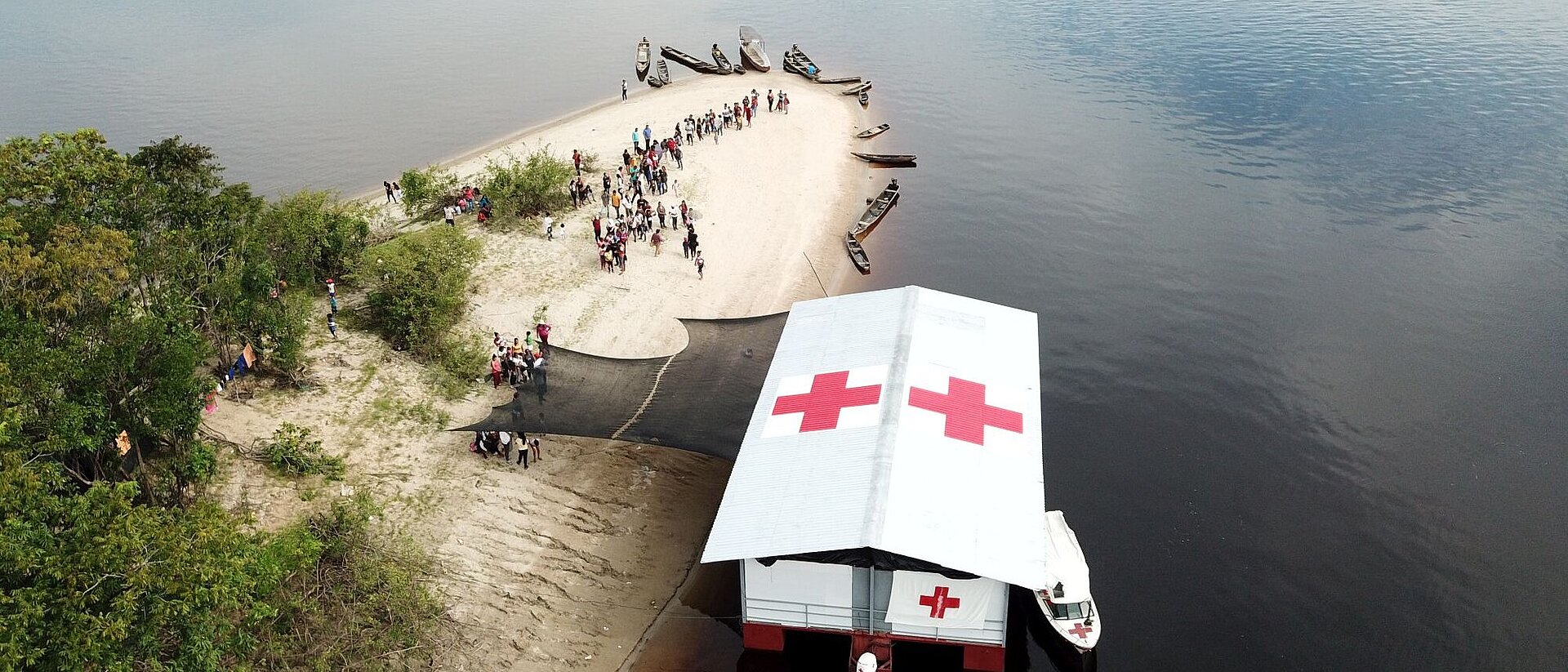 Red Cross boat at shore
