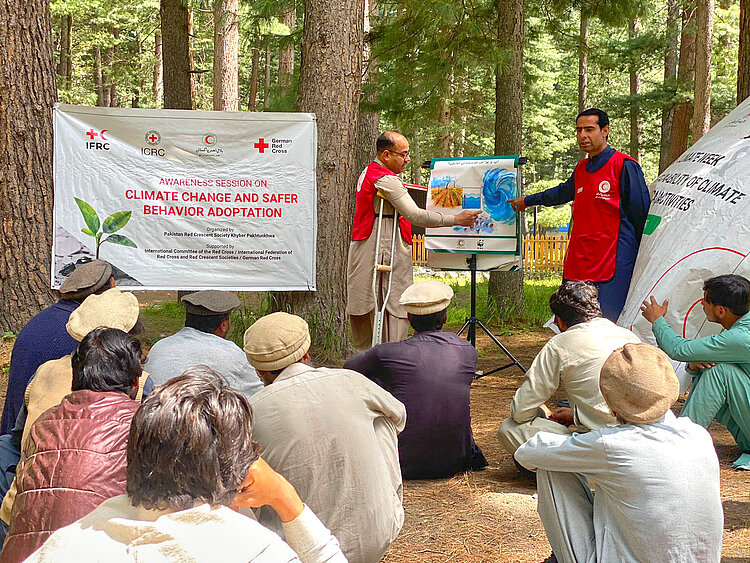 Red Crescent volunteer speaking in front of group
