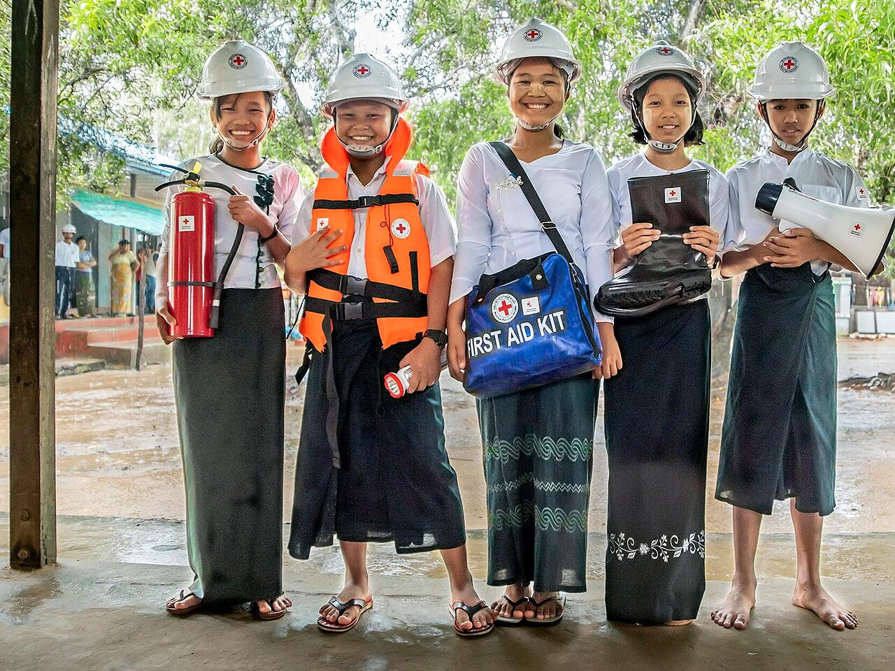 Girls presenting First Aid Kits
