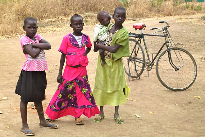 Three children with baby in South Sudan