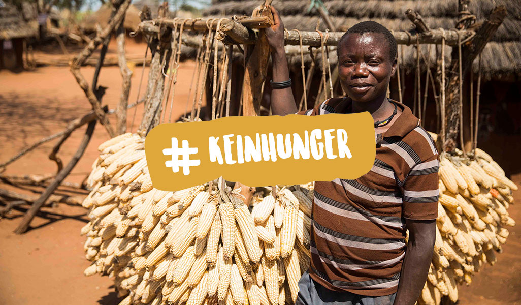 Bild: Mann mit Maiskolben trocknen + Hashtagwort - Kein Hunger