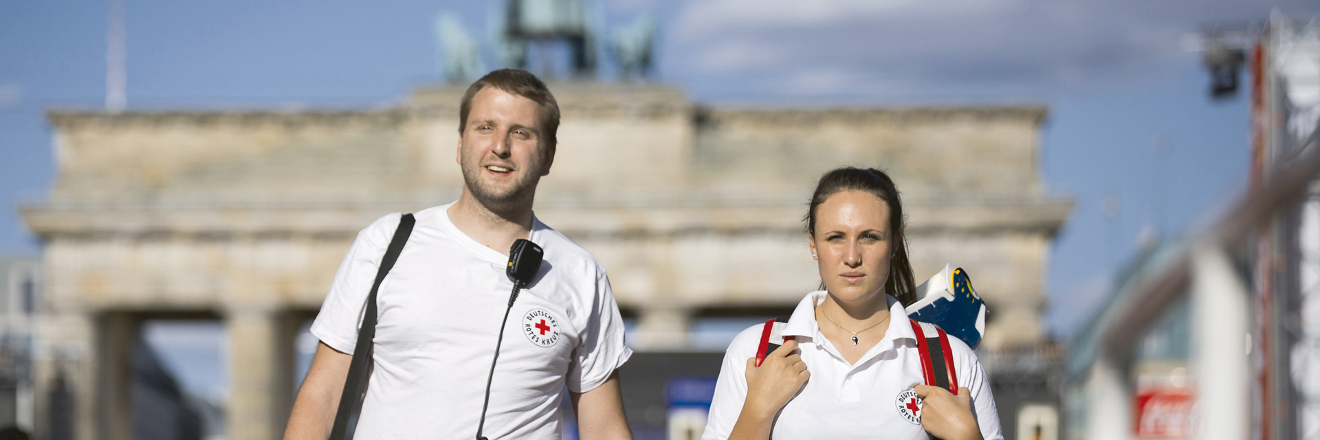 two GRC volunteers in front of the Brandenburg Gate